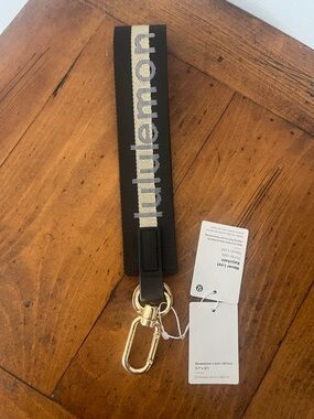 Lululemon Black & Gold Never Lost Keychain